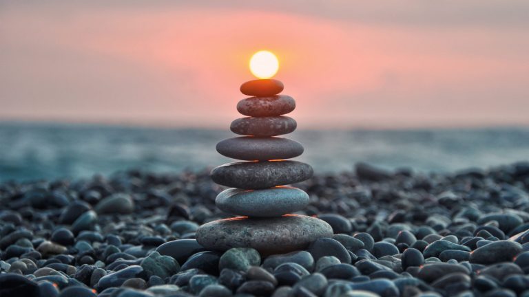 Stacked Rocks with Sun